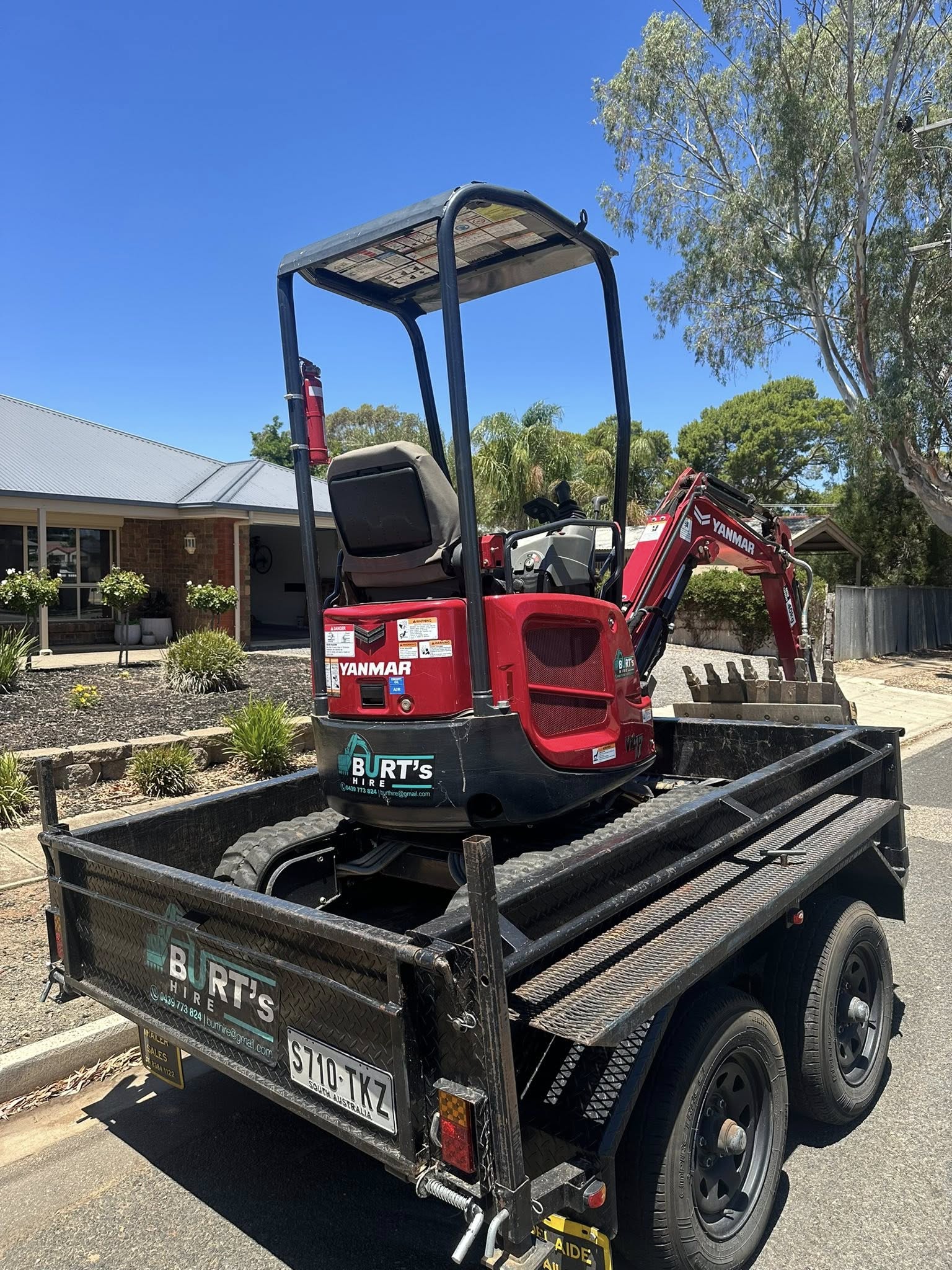 Excavator loaded on trailer ready for delivery